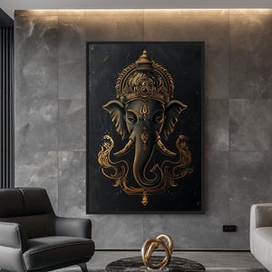 May include: A black and gold framed canvas print featuring a detailed illustration of the Hindu deity Ganesha, depicted as an elephant with a crown and ornate decorations.