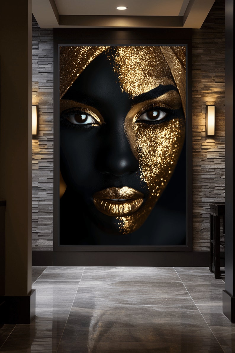 May include: A close-up of a woman's face with black skin and gold glitter makeup. The image is in black and white with a gold overlay.