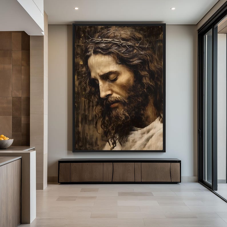 May include: A large framed painting of a man with a crown of thorns and a beard, looking down with his eyes closed. The painting is in a dark, rustic style and is hanging on a wall in a modern home.