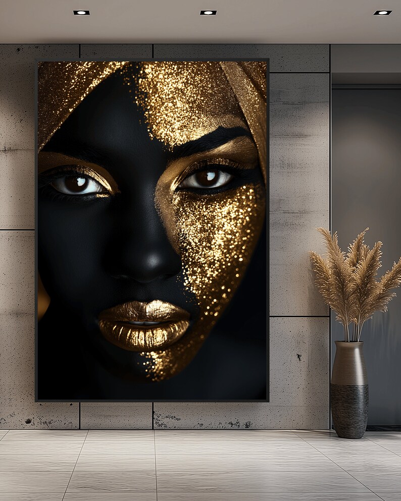 May include: A close-up of a woman's face with black skin and gold glitter makeup. The woman is wearing a gold headscarf.