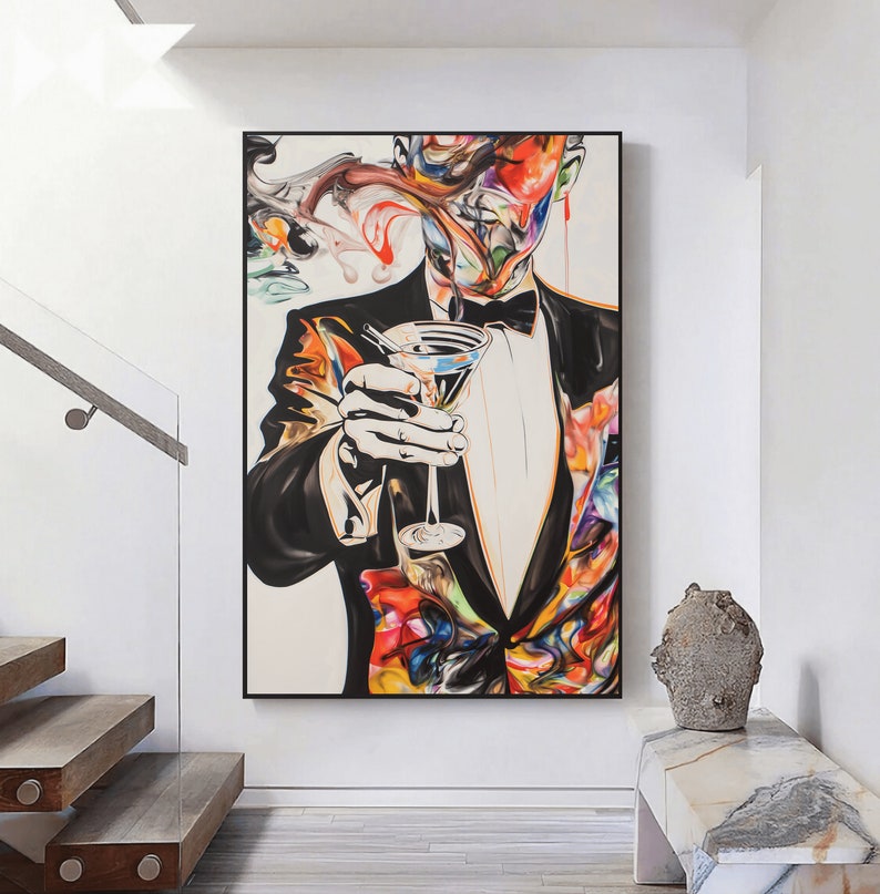 May include: Abstract painting of a person in a tuxedo holding a martini glass. The person's face is obscured by colorful swirls and splatters of paint. The background is white.