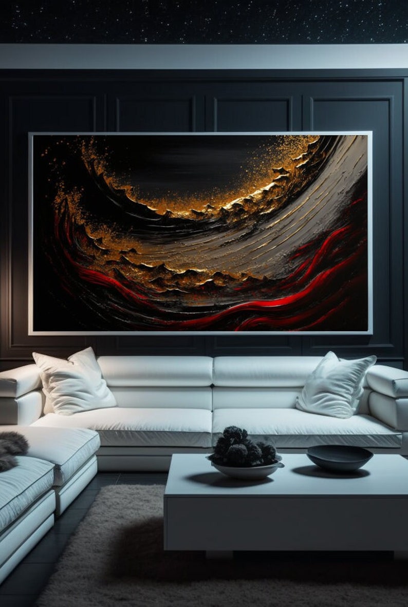 May include: Abstract painting with black, gold, and red colors. The painting is framed and hanging on a black wall above a white sofa.