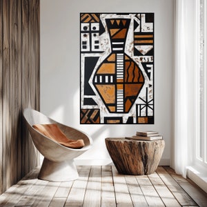 May include: Abstract geometric art print featuring a stylized vase in black, white, and orange tones. The print is framed and hanging on a white wall.