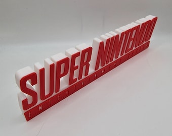 Logotipo del videojuego Super Nintendo de 19 cm (impreso en 3D, para sala de juegos, estantería, pared, videojuegos, decoración, logotipo, juego, arte para fans de la música)