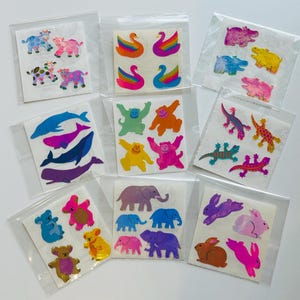 Pegatinas vintage de Sandylion: vacas perladas, cisnes, hipopótamos, ballenas, monos, lagartos, koalas, elefantes y conejos.