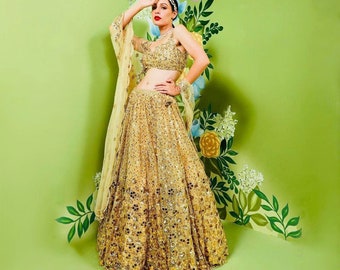 yellow lehenga choli, embellished with stunning embroidery and sparkling sequences that evoke the magic of spring.