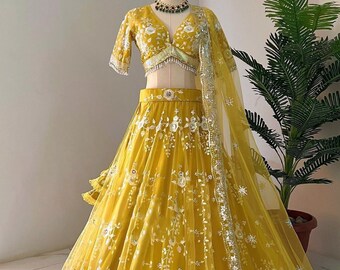 yellow lehenga choli, embellished with stunning embroidery and sparkling sequences that evoke the magic of spring.