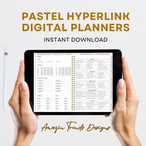 May include: A digital planner on a tablet with a pastel color scheme. The planner includes sections for index, meals, monthly, notebook, projects, goals, lifestyle, wellness, finances, productivity, health and fitness, and essence. The text "Amazin Trends Designs" is at the bottom of the screen.