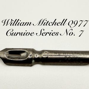 May include: A silver metal nib for a fountain pen, labelled "W. Mitchell 0977 England" and "7". It is part of the "Cursive Series No. 7" collection.
