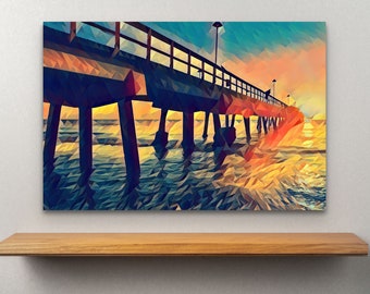 May include: A digital art print of a pier extending over water at sunset. The artwork features a low-poly style with geometric shapes in shades of blue, orange, and yellow. The pier's structure and the water's reflection are visible.