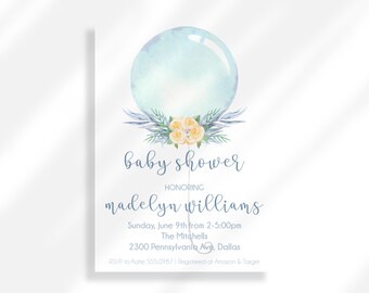 May include: A blue and white baby shower invitation with a watercolor illustration of a balloon and flowers. The text reads "baby shower honoring madelyn williams Sunday, June 9th from 2-5:00pm The Mitchells 2300 Pennsylvania Ave, Dallas RSVP to Kake 555.0987 | Registered of Amazon & Target"