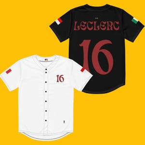 May include: White and black baseball jersey with red number 16 and the name "Leclerc" on the back. The jersey has a small Italian flag on the sleeve.