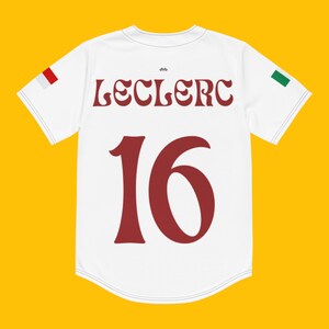 May include: White jersey with red and green accents. The back of the jersey has the name "Leclerc" and the number "16" in a retro font.