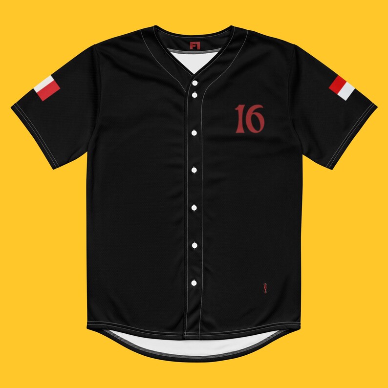 May include: Black baseball jersey with red stitching and a red number 16 on the front. The jersey has white trim around the collar and sleeves. The sleeves have a red and white flag on each side.
