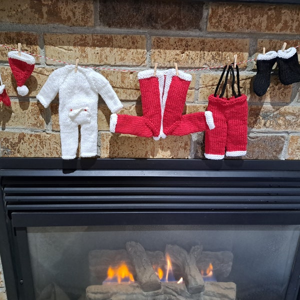 Santa's Laundry Clothesline for Christmas. Includes Hat, mitts, boots, long johns, coat and pants with suspenders, clotheline, clothespins.