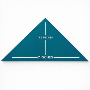 May include: A teal-colored, triangular quilting template with white markings. The template is labeled with measurements: 3.5 inches and 7 inches. The tool is designed for fabric cutting and sewing projects.