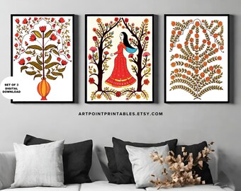 May include: Set of three digital prints featuring Indian folk art style illustrations. The first print shows a vase with a red and orange floral design. The second print shows a woman in a red dress standing in a garden with a floral archway. The third print shows a floral design with a white background.