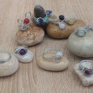 Ring in stainless steel, copper or brass with insertion of real round stones