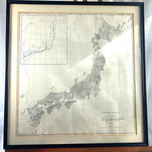 May include: A black and white photorealistic diagram of Japan, showing the islands and surrounding waters. The map is titled "Photographic Diagram of Japan" and signed "Percy Arnold Smith, by G.P. Harold Smith, 1933".