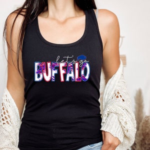 May include: Black tank top with a red, white, and blue graphic that says "Let's go Buffalo" with a buffalo silhouette.