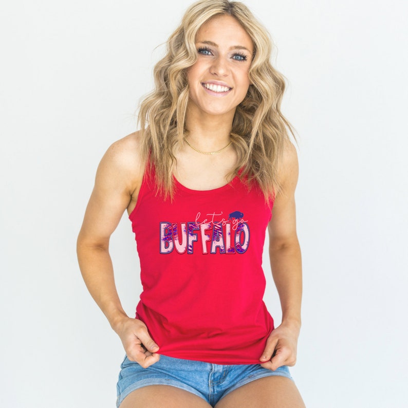 May include: Red tank top with a white and blue graphic that says "let's go BUFFALO".