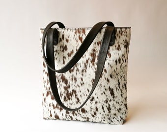 Cowhide and leather shoulder bag. Sustainably made, tough and unique