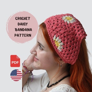 May include: A crochet daisy bandana pattern in PDF format. The pattern features a pink bandana with white and yellow daisy flowers. The pattern is available for download in English.