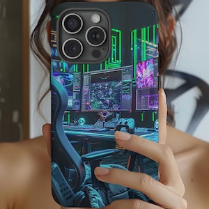 May include: A black phone case with a gamer themed design. The case features a close-up of a gaming setup with multiple monitors, a keyboard, and a gaming chair.