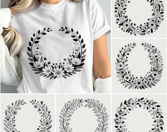 May include: White t-shirt featuring a black floral wreath design. The wreath is composed of leaves and flowers, creating a circular pattern. Additional images show similar floral wreath designs, perfect for crafting or design projects.