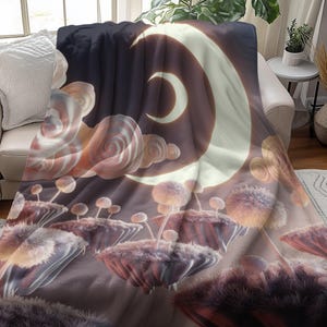 May include: A soft, plush throw blanket with a whimsical design featuring a crescent moon and delicate, pastel-colored flowers. The blanket is perfect for adding a touch of magic to any room.