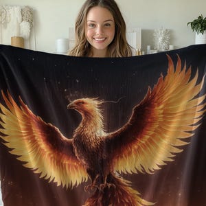 May include: A black tapestry with a golden phoenix rising from flames against a dark starry background.