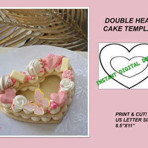May include: Printable template for a double heart-shaped cake. The template is 8.5 inches by 11 inches and is designed for US letter size paper. The image shows a decorated cake with pink and white frosting, sprinkles, and a butterfly.