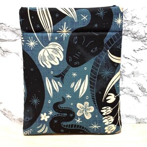 May include: A blue fabric pouch with a black snake and floral pattern. The pouch has a zipper closure and is ideal for carrying small items.