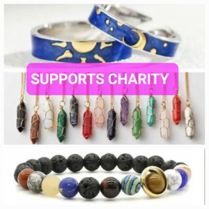 May include: Two silver rings with blue enamel and gold accents, a set of crystal necklaces with gold chains and a black lava rock bracelet with colorful gemstone beads. The image includes the text "SUPPORTS CHARITY".