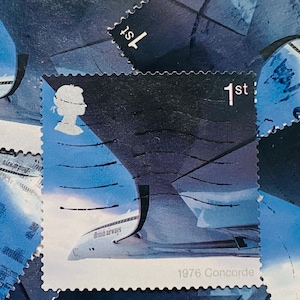 May include: A vintage British Airways stamp featuring a blue and white Concorde airplane with the text "British Airways" and "1976 Concorde". The stamp is a 1st class stamp and features a portrait of the Queen.