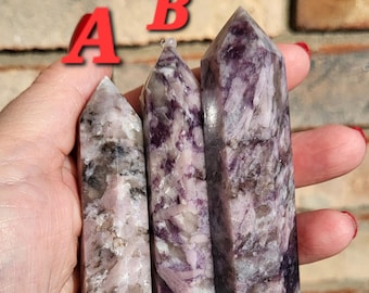May include: Three purple and white striped crystal wands labeled A, B, and C.