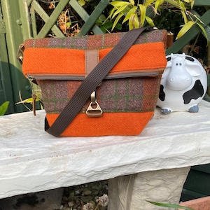 Made to order. Foldover Bag in Harris Tweed Rust/brown/green check & tan leather trims. Smart casual crossbody. Authenticity label.