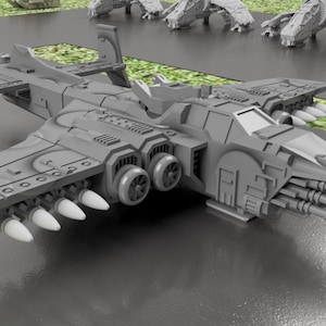 May include: A gray plastic model of a futuristic spaceship with a long, narrow body, two large engines, and a variety of weapons. The spaceship has a detailed design with many small parts and a sleek, aerodynamic shape.