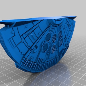 May include: A blue 3D printed model of a spaceship with a detailed design and a rounded shape.