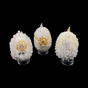 May include: A set of three ceramic mugs with a speckled, matte finish. The mugs are in shades of cream, light gray, and dark gray. Each mug has a simple, minimalist design, perfect for coffee or tea.