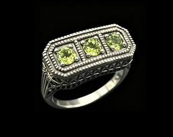 Anillo vintage de tres piedras con peridoto verde en plata de ley 925, en estuche de regalo.