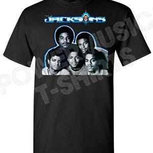 May include: Black t-shirt with a graphic of the Jackson 5 band members. The band's name "The Jacksons" is printed in blue and white letters above the image.