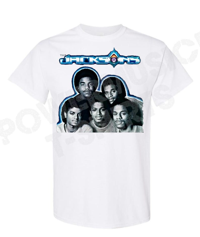May include: White t-shirt with a black and white photo of The Jacksons band members. The band's name is printed in blue and white above the photo.