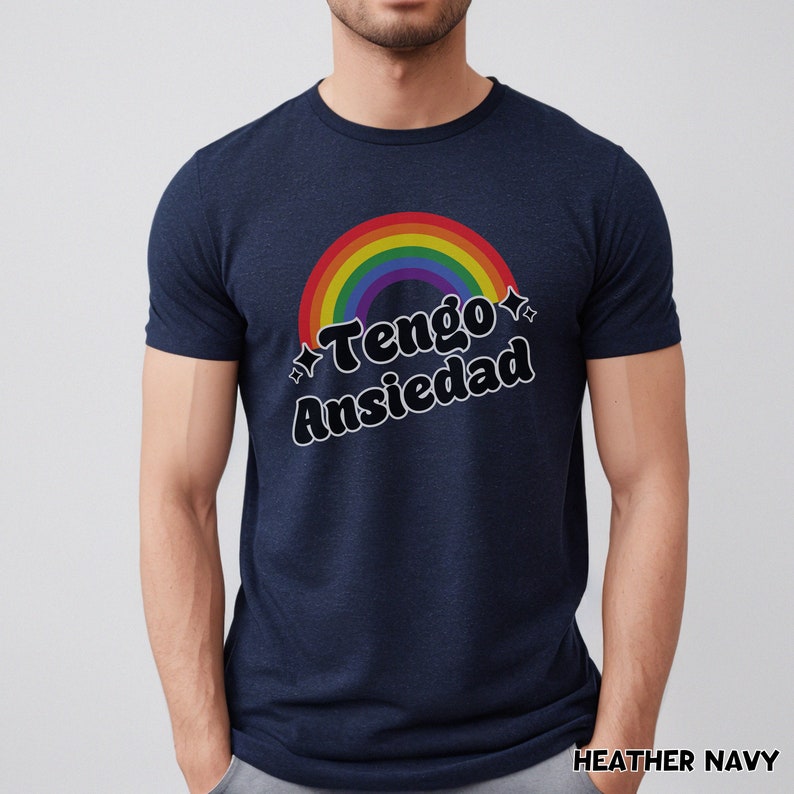 May include: A navy blue t-shirt with a rainbow and the text "Tengo Ansiedad" in black.