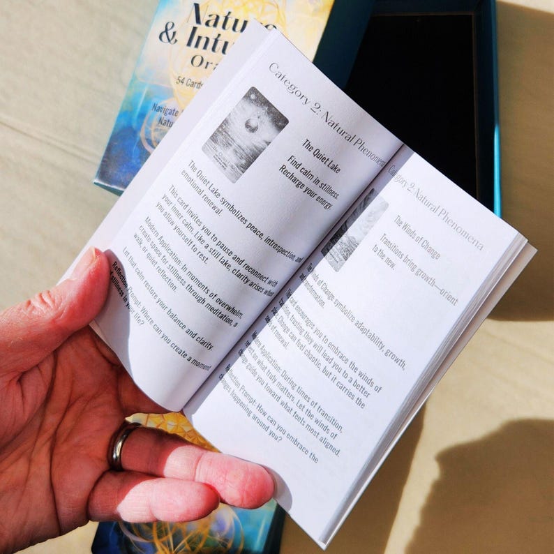 Open guidebook from Nature & Intuition Oracle Deck showing card meanings and reflection prompts