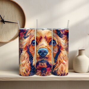 May include: Three stainless steel tumblers with a colorful abstract design of a cocker spaniel dog's face. The tumblers are lined up side by side on a shelf.