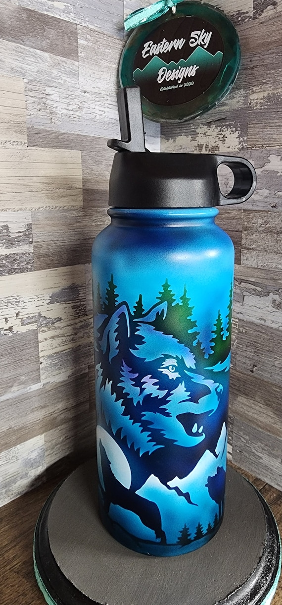 Airbrushed nature scene with wolves water bottle