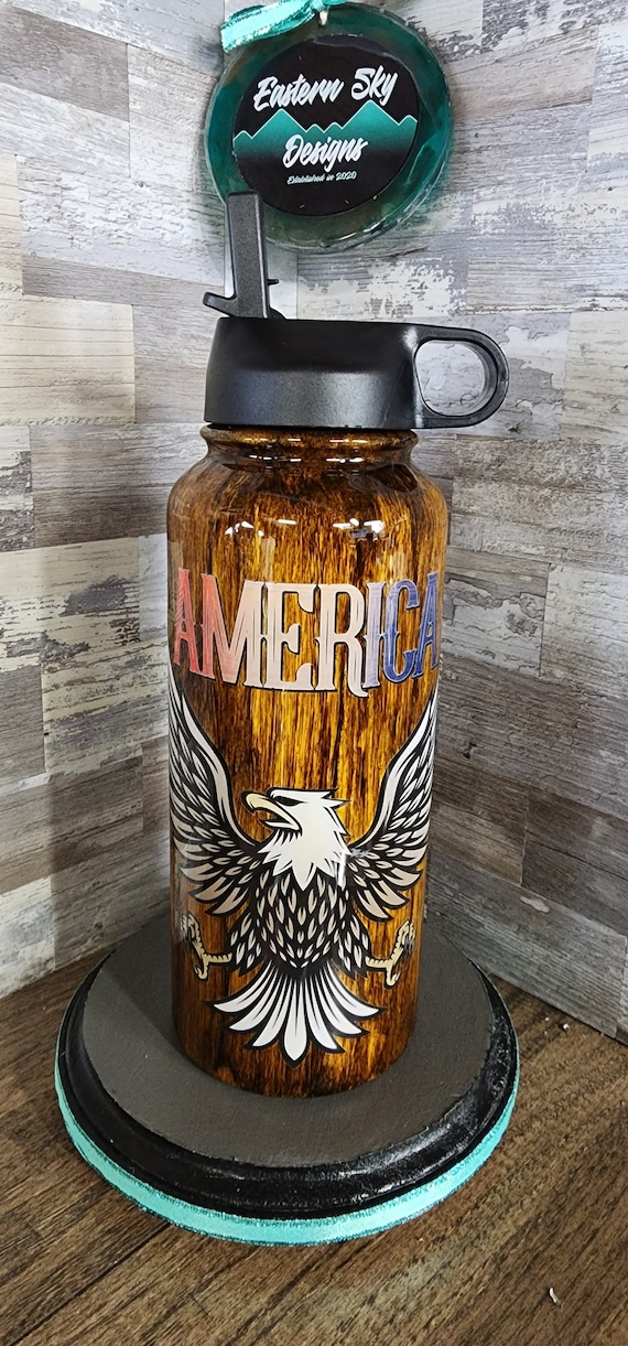 Skinny tumbler with America and vintage style eagle on woodgrain