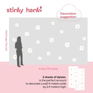 May include: White daisy wall decals with yellow centers are shown on a grey wall. The image includes the text "sticky hack!" and "Decoration suggestion". The wall is 4 metres wide (157 inches) and 2.4 metres high (94 inches).