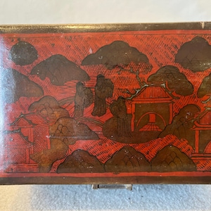 Antique Asian Red lacquerware wooden box with landscapes and figurative decorations.